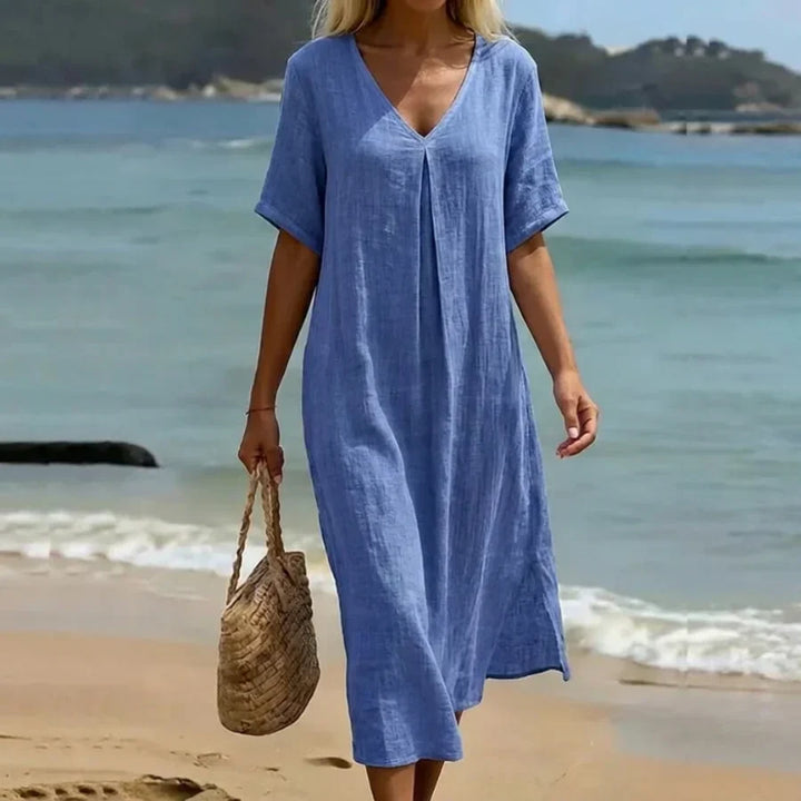 Women's relaxed v-neck midi dress with short sleeves, perfect for casual summer days.