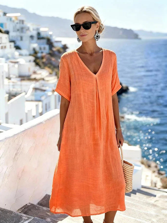 Soft, relaxed fit women's midi dress with v-neck and short sleeves for ultimate comfort.