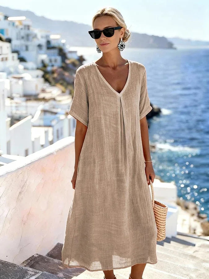 Relaxed women's v-neck midi dress with short sleeves, perfect for summer, coastal, or everyday wear.
