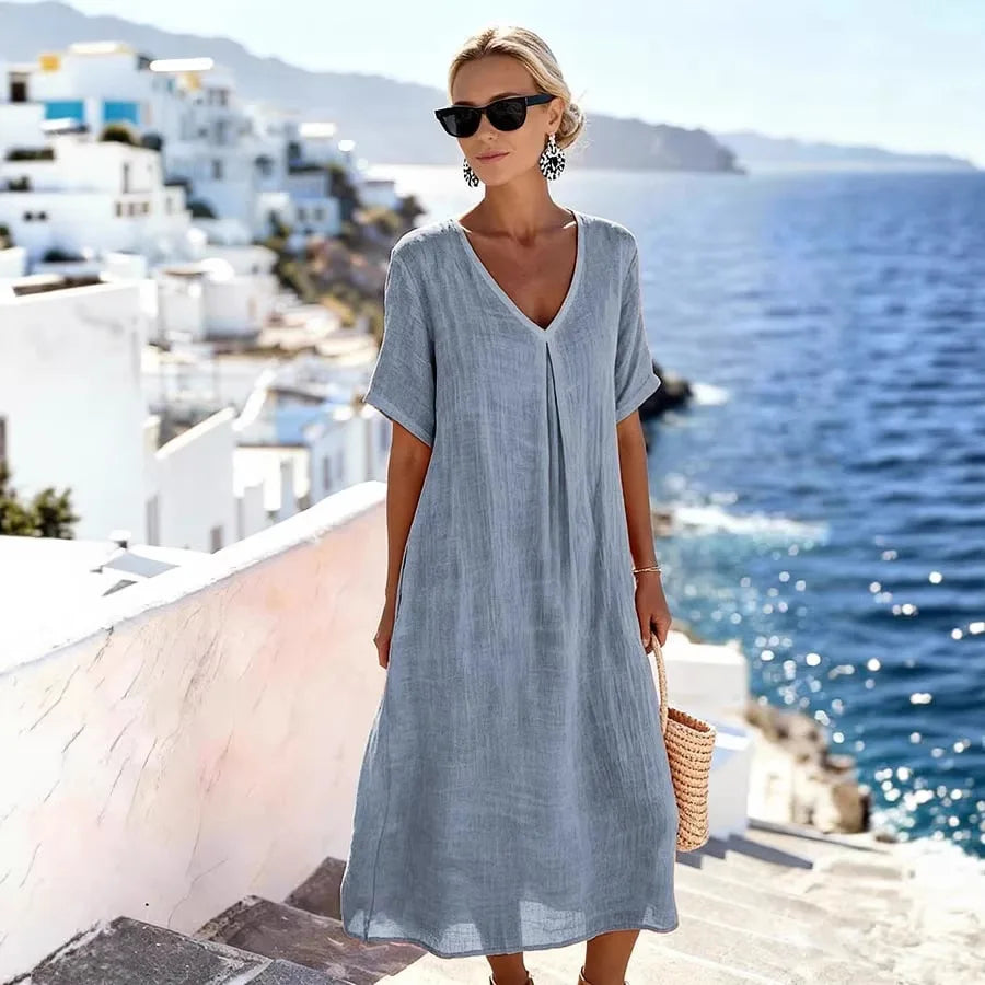 Casual women's v-neck midi dress with short sleeves, great for everyday wear or vacation.