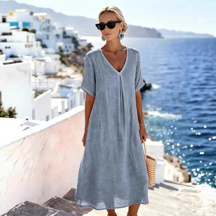 Casual women's v-neck midi dress with short sleeves, great for everyday wear or vacation.