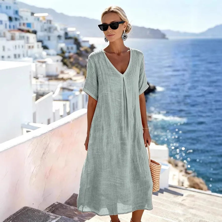 Comfortable relaxed fit women's v-neck midi dress, short sleeves for summer ease.