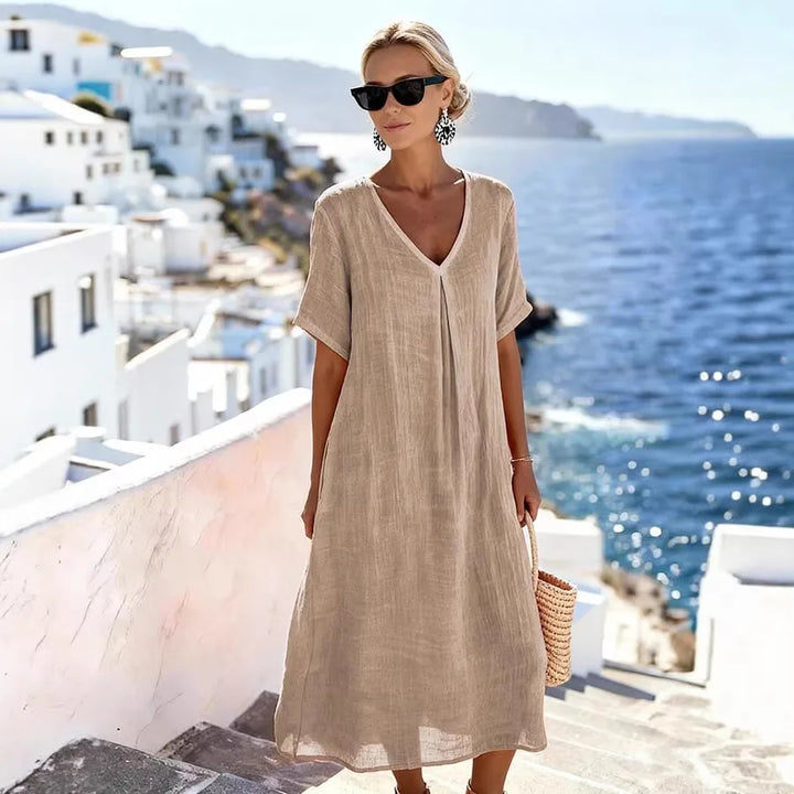 Stylish women's relaxed v-neck midi dress, short sleeves, perfect casual or vacation outfit.