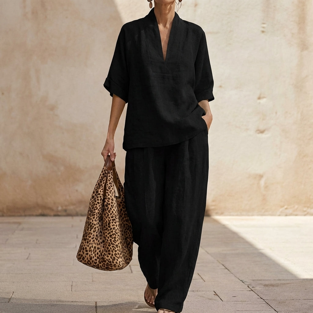 Elegant loungewear: womens relaxed two-piece set with flowy wide-leg pants & stylish V-neck top.