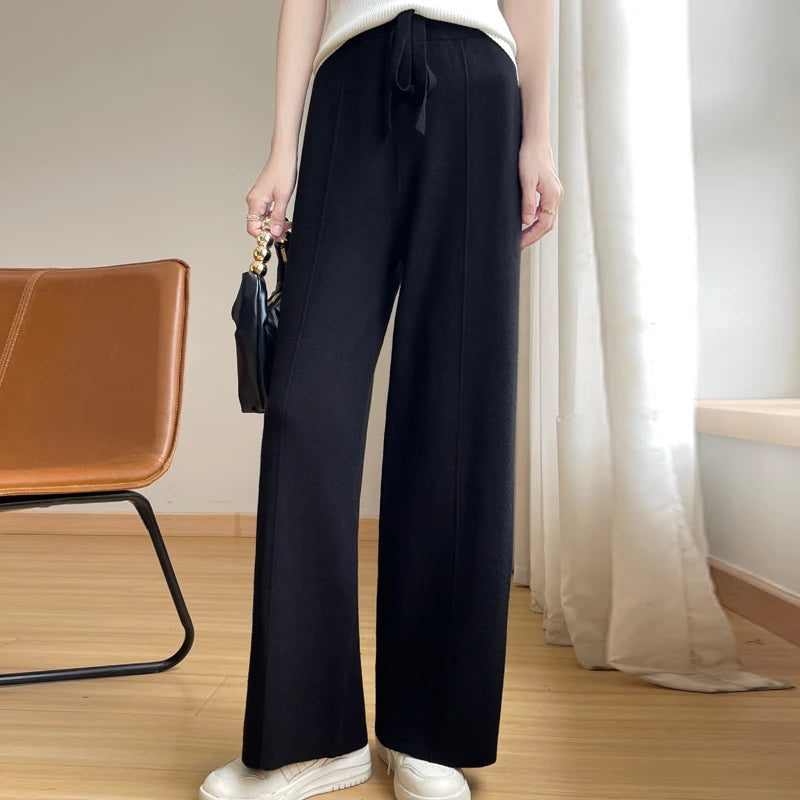 Chic women's relaxed wide-leg trousers with adjustable waist for comfort; available in black, tan, beige.