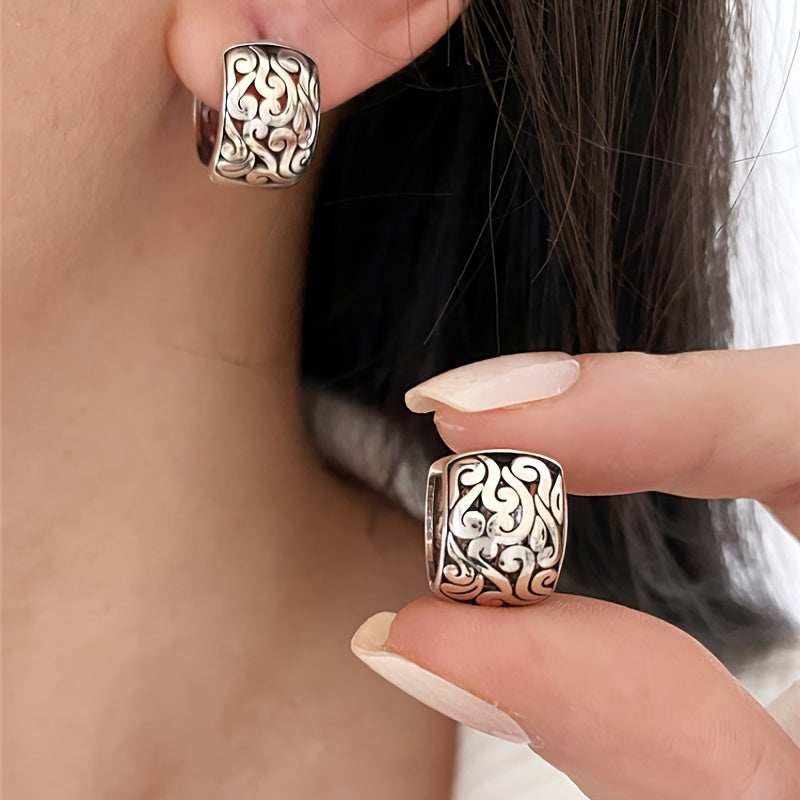 Vintage sterling silver engraved earrings for women, featuring a unique oxidized finish. Statement jewelry.