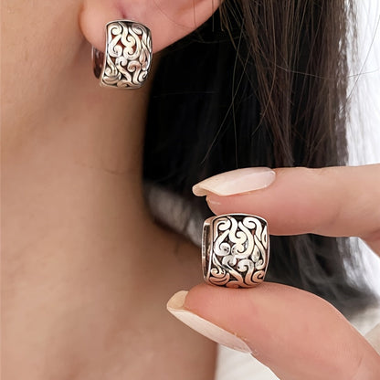 Vintage sterling silver engraved earrings for women, featuring a unique oxidized finish. Statement jewelry.