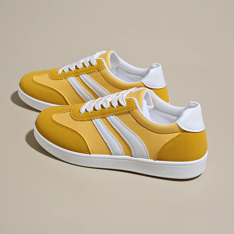 Lace-up women's vintage style retro sneakers, offering comfort for casual footwear & 80s fashion enthusiasts.