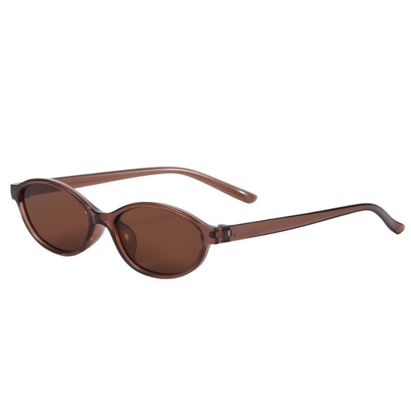 Elegant brown women's retro cat-eye sunglasses, lightweight 90s eyewear.