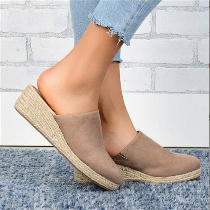 Slip-on women's retro wedge sandals, offering stylish comfort and a chic summer look.