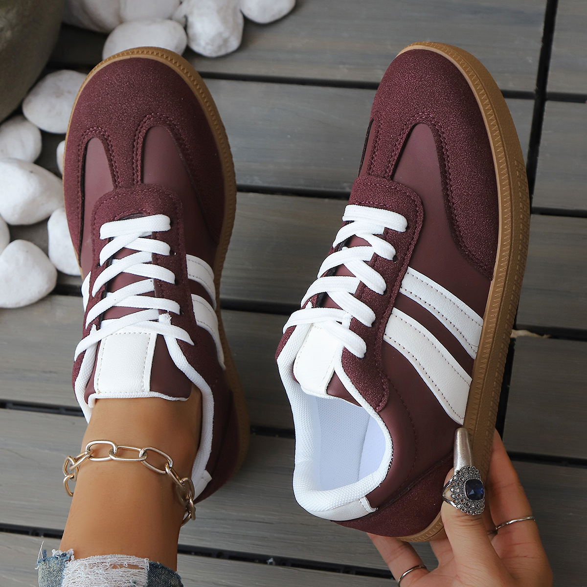 Woman wearing retro comfort sneakers for casual everyday activities. Vintage athletic streetstyle footwear.