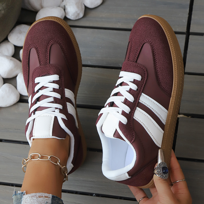 Woman wearing retro comfort sneakers for casual everyday activities. Vintage athletic streetstyle footwear.