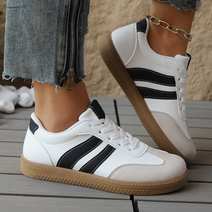 Detailed view of women's retro comfort sneakers. Vintage style footwear with quality construction.