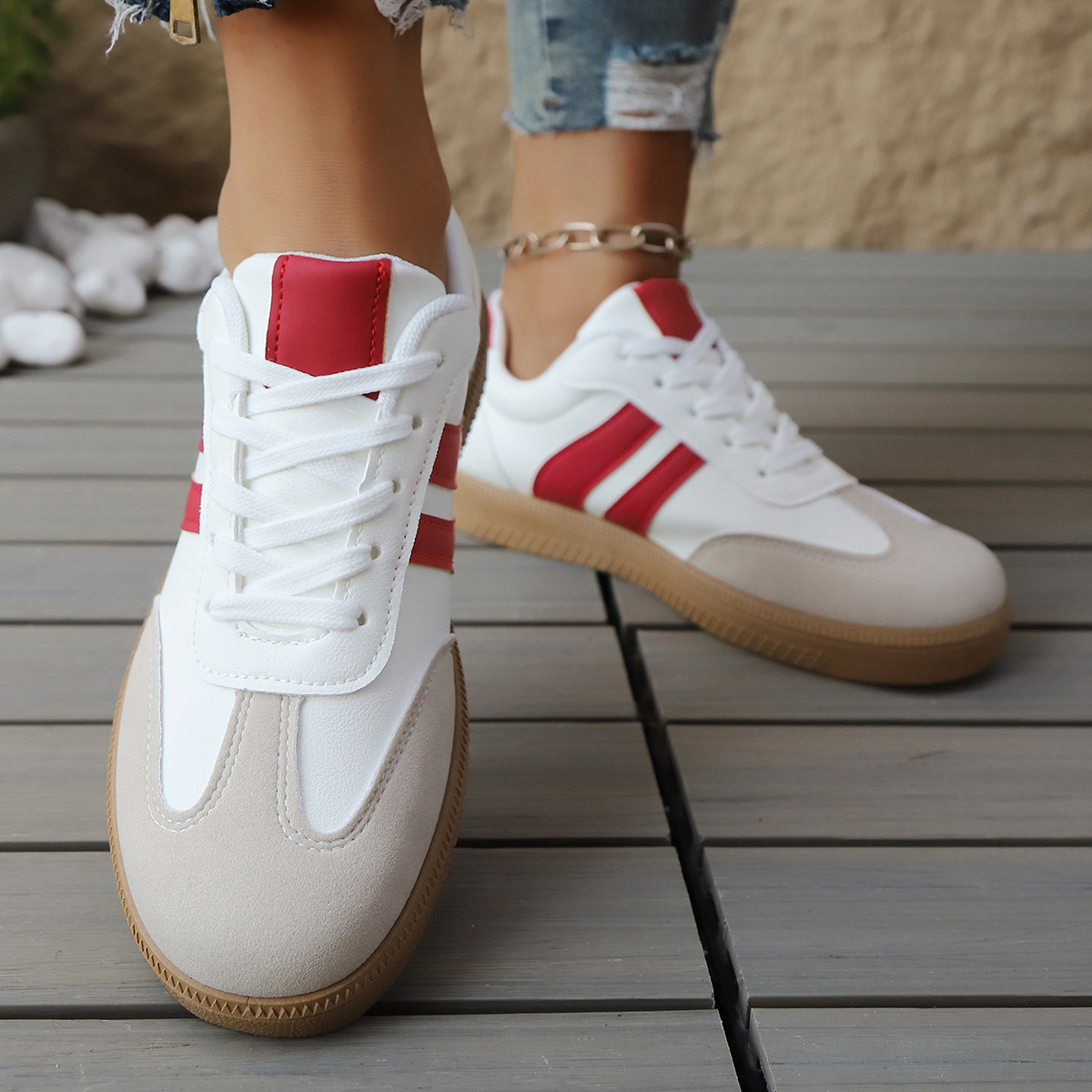 Vintage-style women's athletic sneakers, retro design. Classic footwear for streetstyle and everyday comfort.