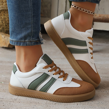 Side view of women's retro comfort sneakers. Vintage athletic footwear for casual everyday style.