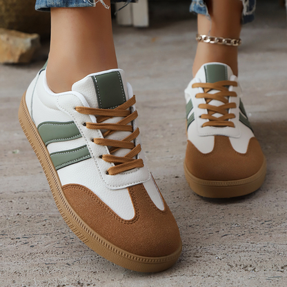Close-up of women's vintage-style sneakers. Retro comfort footwear with classic detailing.