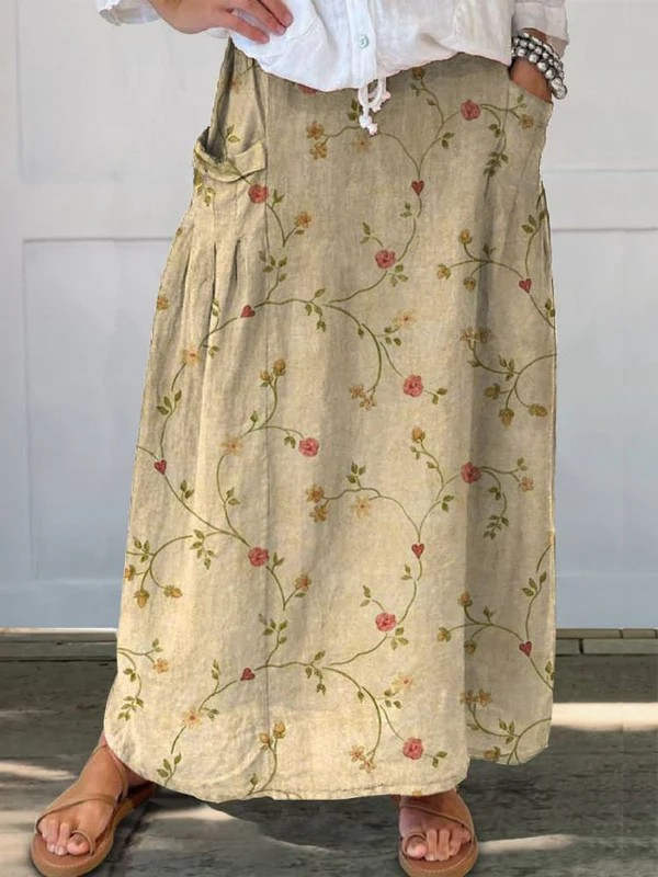 Women's retro floral A-line midi skirt with pockets, elastic waist, perfect for casual everyday wear.