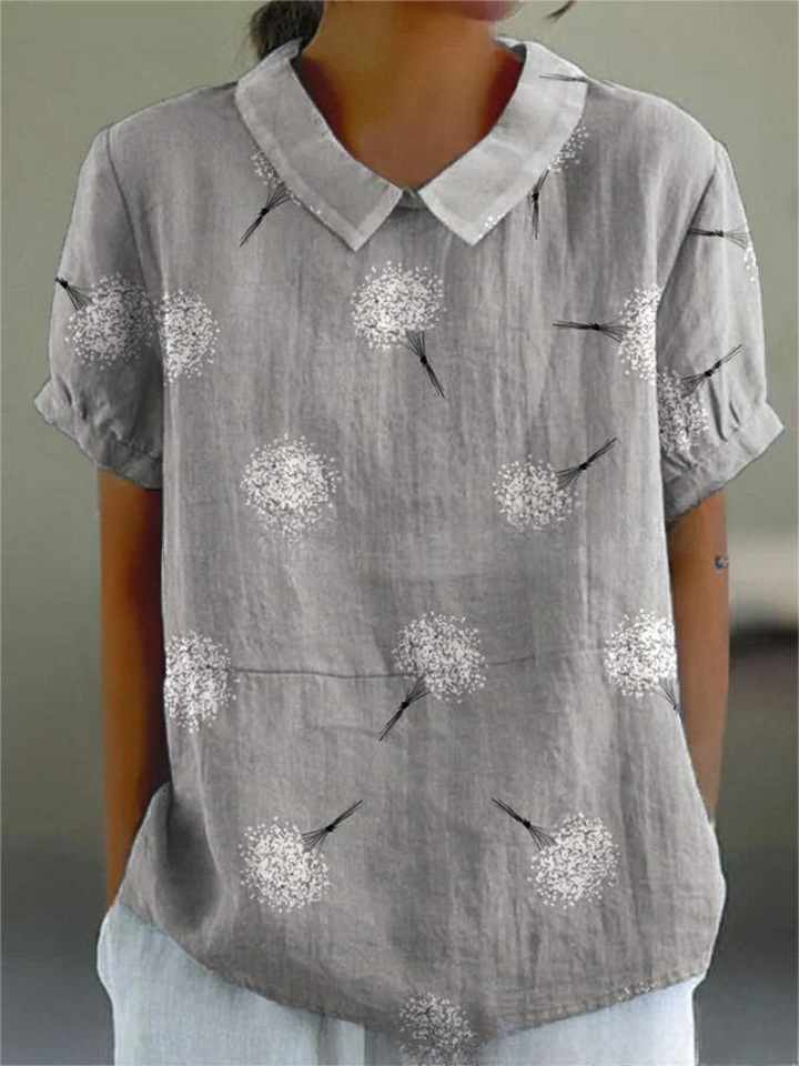 Vintage-inspired women's floral embroidered short sleeve blouse, a summer fashion essential.