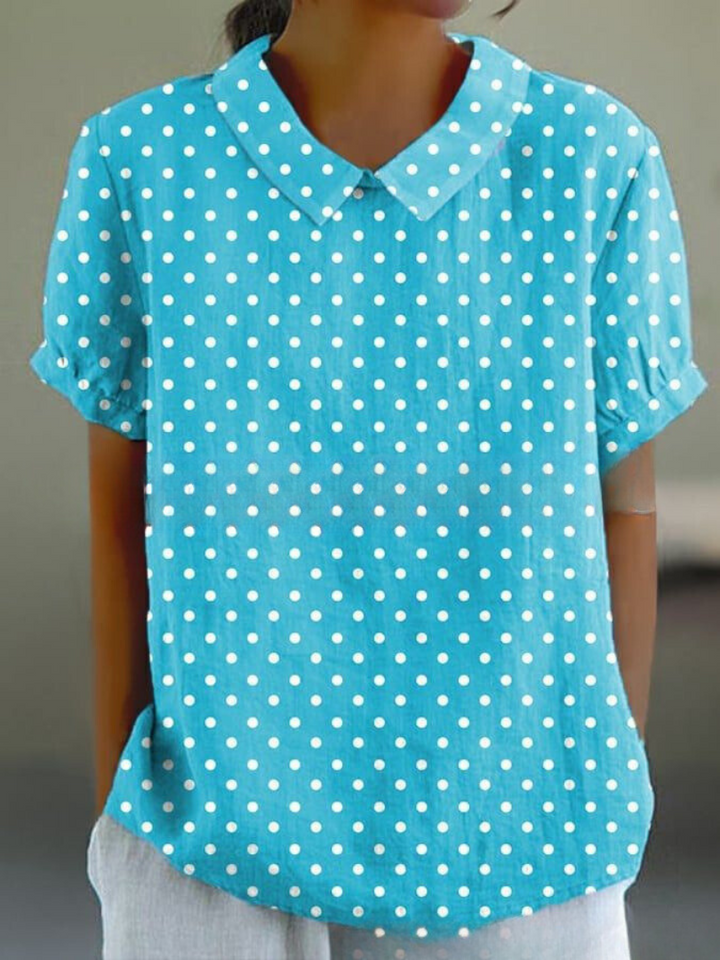 Women's floral embroidered short sleeve blouse, vintage style, ideal for elegant summer fashion.