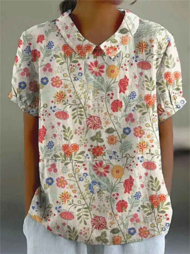 Casual chic women's short sleeve floral top, embroidered retro design, perfect for spring outfits.