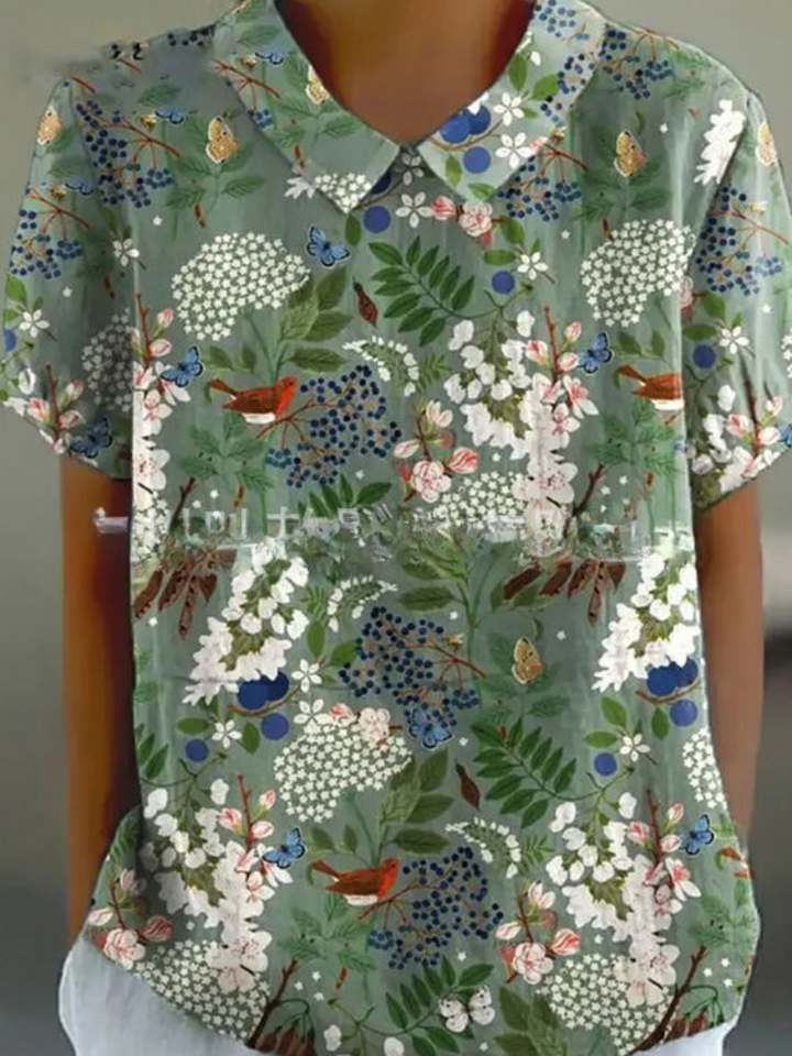 Relaxed fit women's retro floral blouse, short sleeve, great for daily summer wear.