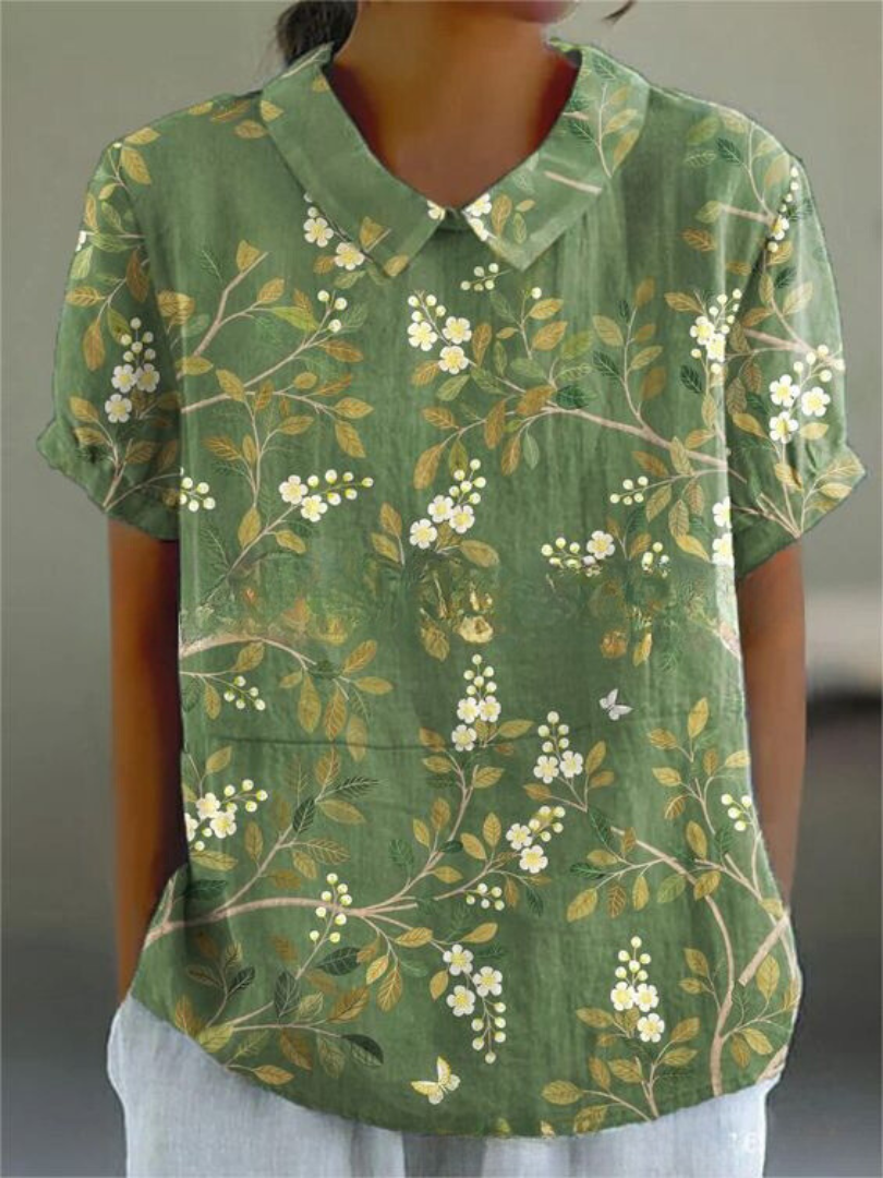 Spring fashion women's short sleeve top with intricate floral embroidery, vintage style.