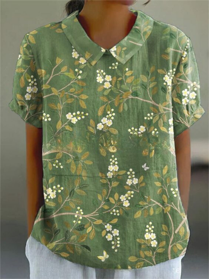 Spring fashion women's short sleeve top with intricate floral embroidery, vintage style.