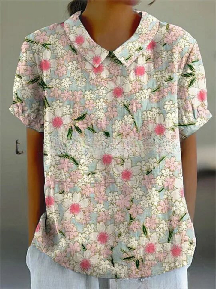 Embroidered women's collared blouse, short sleeves, retro floral design for elegant wear.
