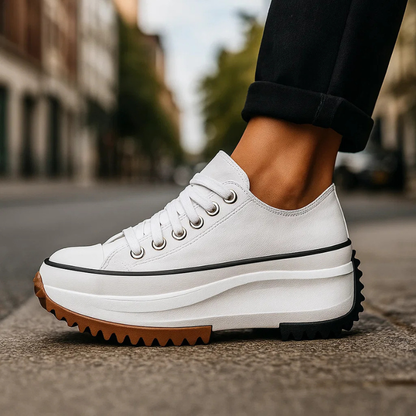 Comfortable women's platform sneakers with retro design, lace-up closure & cushioned sole for daily wear.