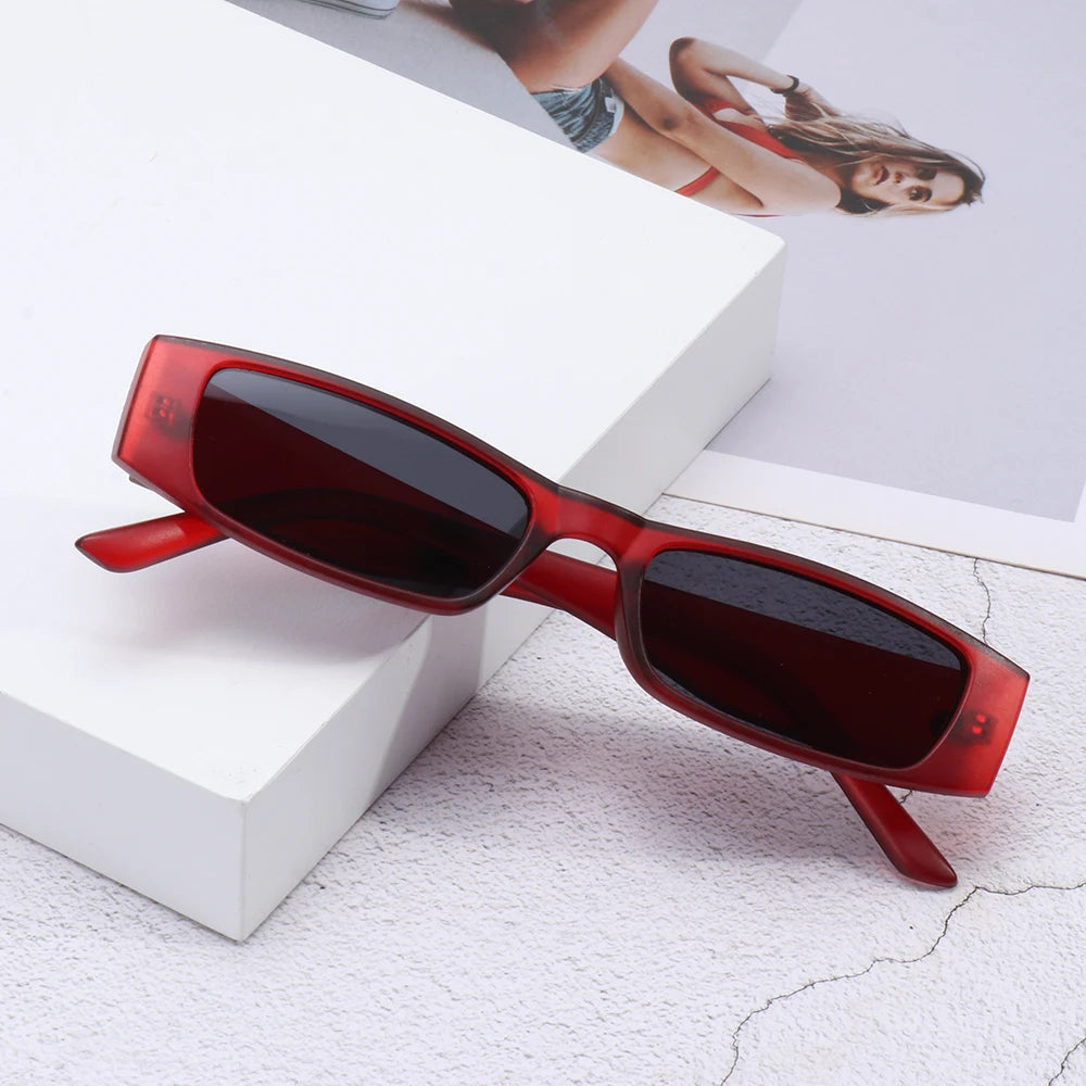 Trendy women's slim retro sunglasses, a chic 90s accessory with effective UV protection for sunny days.