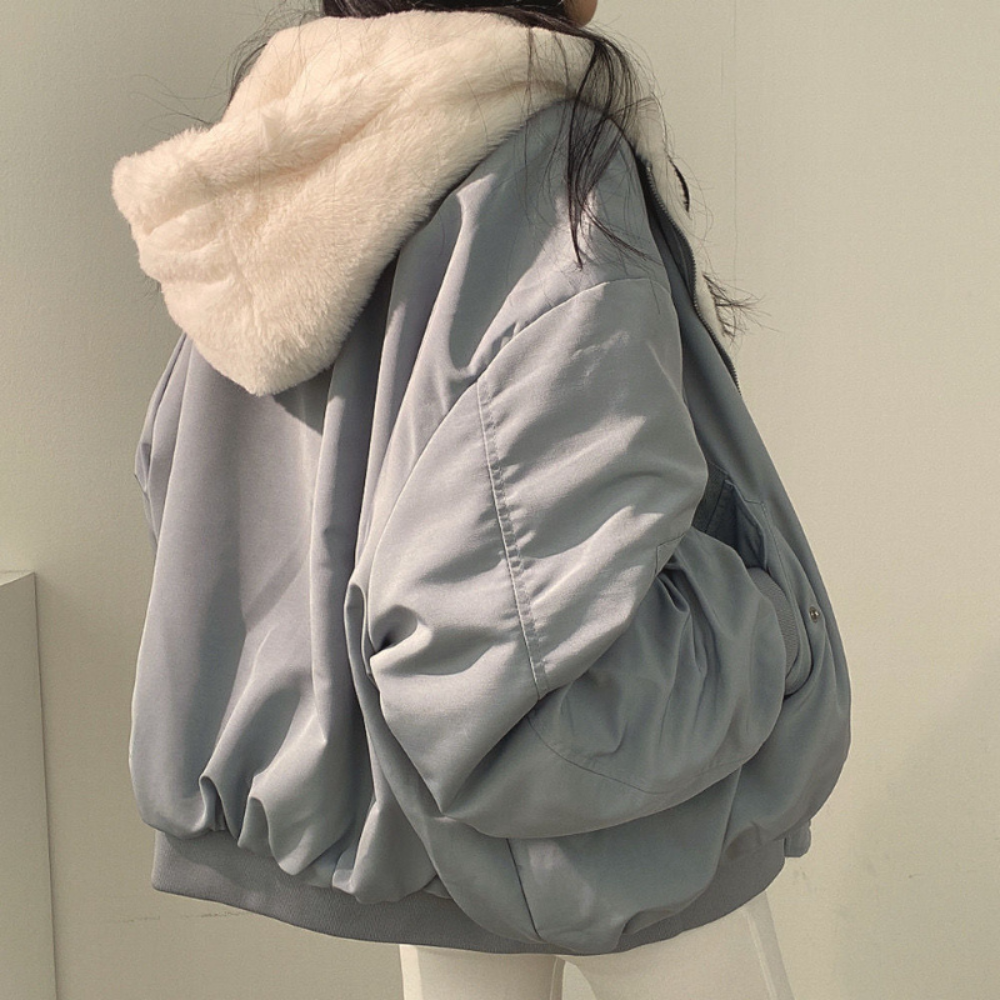 Versatile women's reversible hooded jacket, ideal cozy outerwear for changing fall & winter fashion.