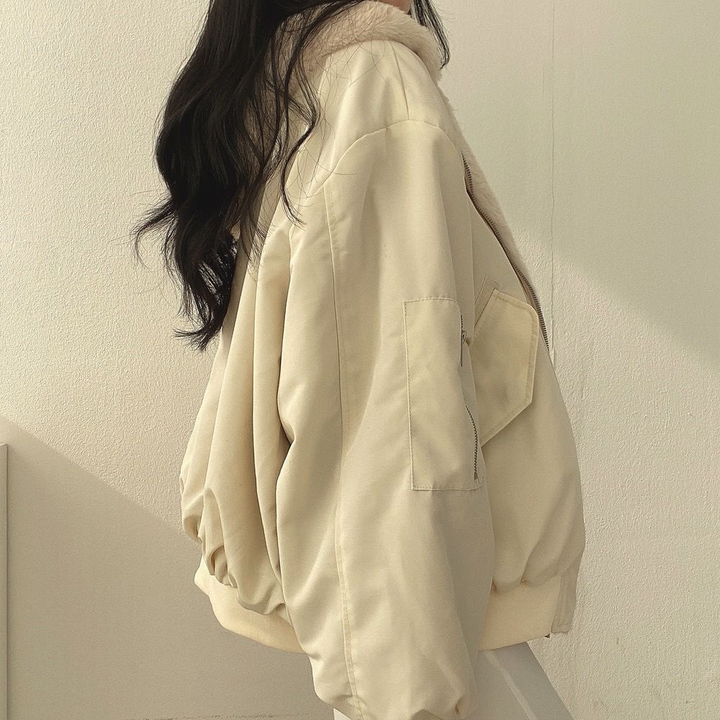 Stylish women's reversible hooded jacket, an essential fall fashion outerwear piece for versatility.