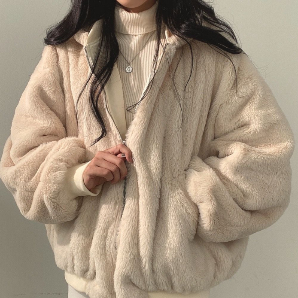 Hooded women's reversible jacket, offering cozy style and warmth for versatile fall & winter fashion.