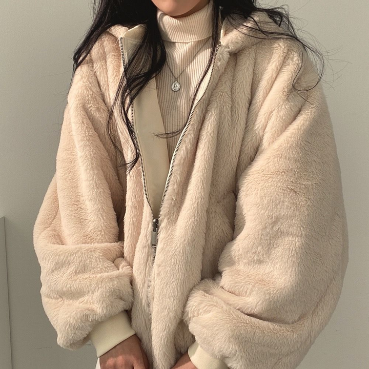 Women's reversible hooded jacket, one side displayed, perfect versatile outerwear for casual looks.