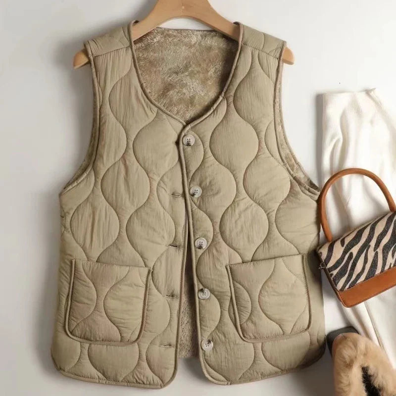 Stylish women's reversible quilted vest, perfect for fall fashion & winter layering.