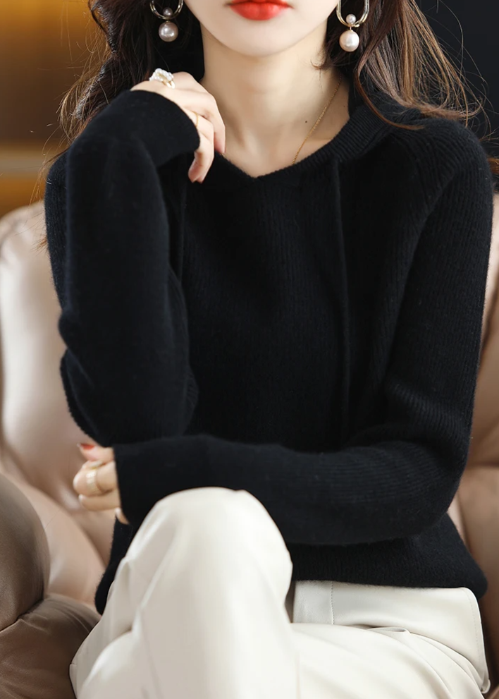Fashionable women's ribbed knit pullover hoodie, effortless chic style.