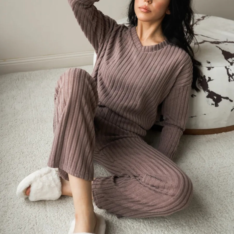 Cozy women's ribbed lounge set with V-neck top & matching pants for ultimate comfort & relaxation.