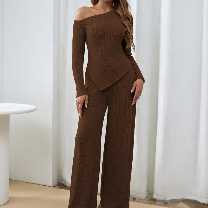Elegant women's ribbed knit one-shoulder two-piece set. Features a chic top & wide-leg pants for comfort.