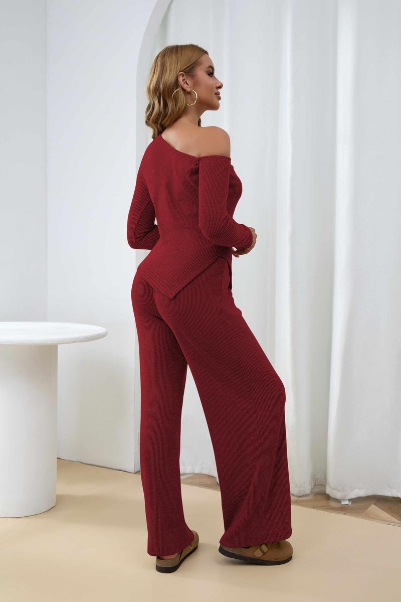 Soft ribbed knit women's one-shoulder two-piece lounge set. Features a chic top and comfortable wide-leg pants.