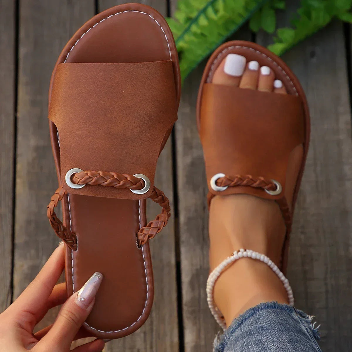 Classic black braided slip-on flat sandals for women, perfect casual summer footwear.