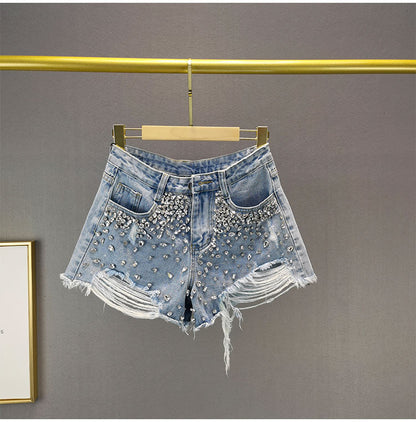 Distressed wide-leg denim shorts for women, ideal for casual summer fashion.