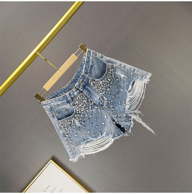 Trendy women's ripped wide-leg shorts, offering a comfortable and stylish fit.