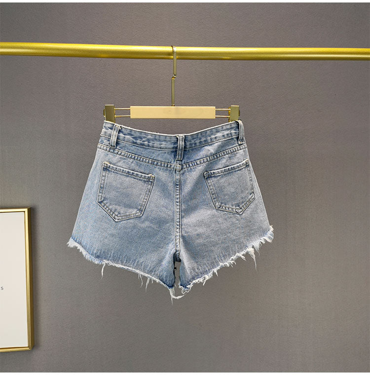Casual high-waisted women's shorts with a fashionable ripped wide-leg design.