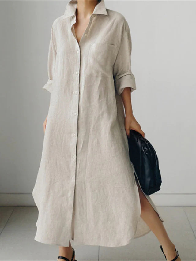 Flowy women's longline shirt dress, designed with comfortable roll sleeves and a stylish button-up front.