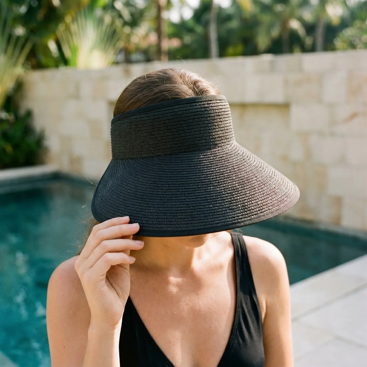 Women's roll-up sun visor hat with wide brim, adjustable, ideal for travel & sun protection.