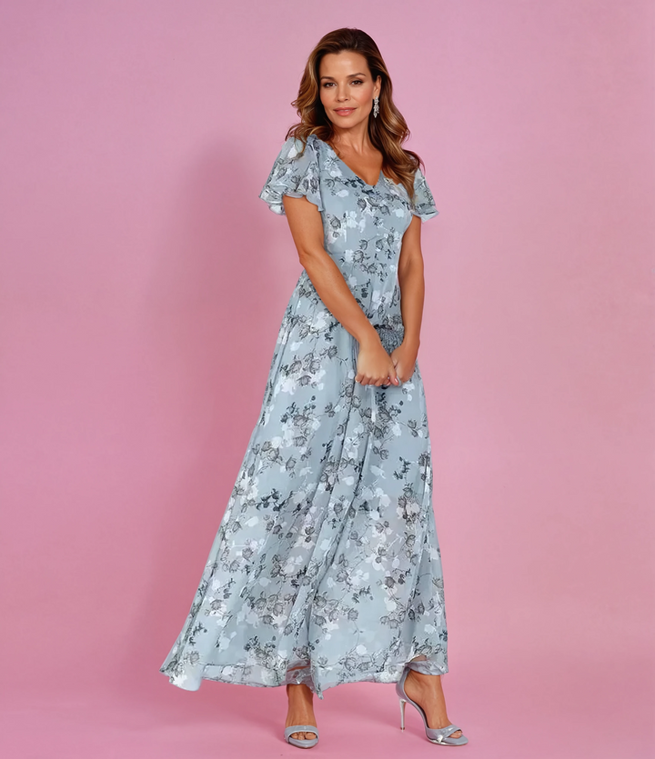 Women's romantic floral maxi dress with flutter sleeves & V-neck. Ideal for summer parties & elegant occasions.