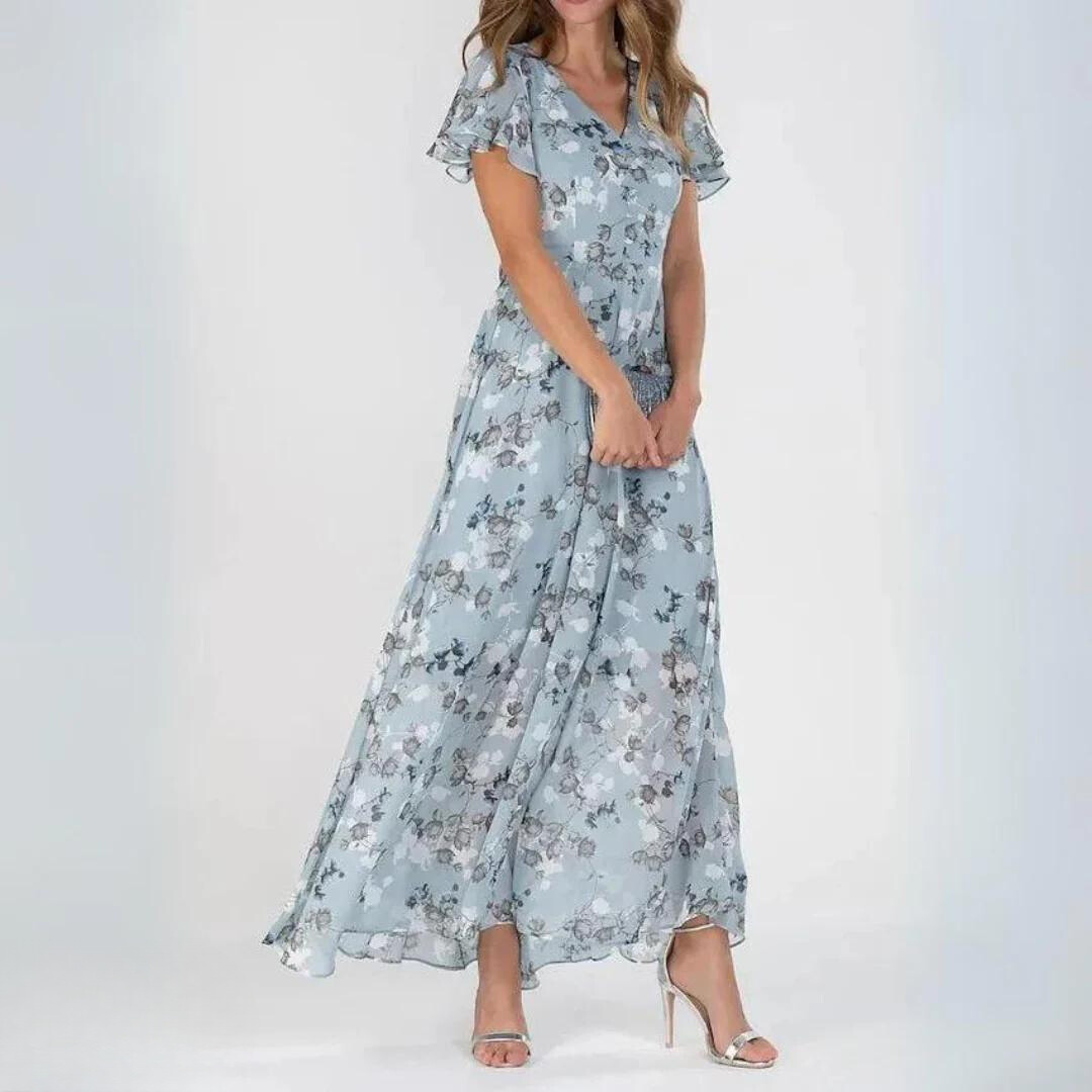Flowy women's romantic floral maxi dress with delicate flutter sleeves & V-neck. Feminine summer fashion.