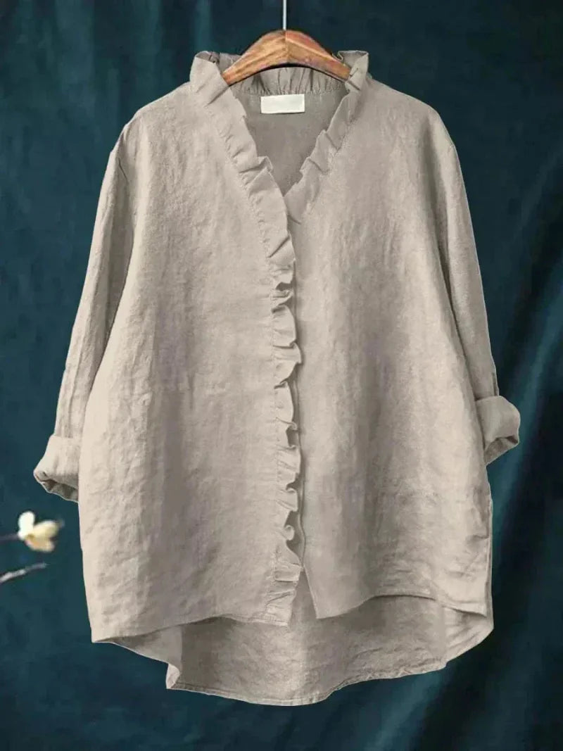 Chic women's oversized ruffle blouse, versatile for casual elegant everyday wear, feminine style.
