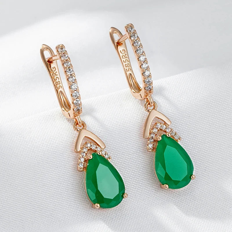 Women's rose gold pavé teardrop gemstone dangle earrings. Elegant sparkling jewelry.