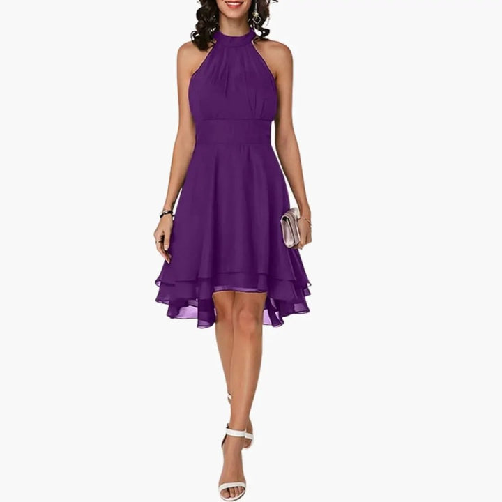 Flattering women's sleeveless ruffle dress, knee-length, round neck. Stylish and comfortable for any casual occasion.